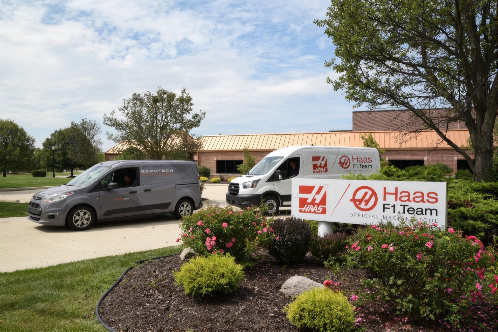 Gerotech and Haas F1 Team vans at Gerotech headquarters